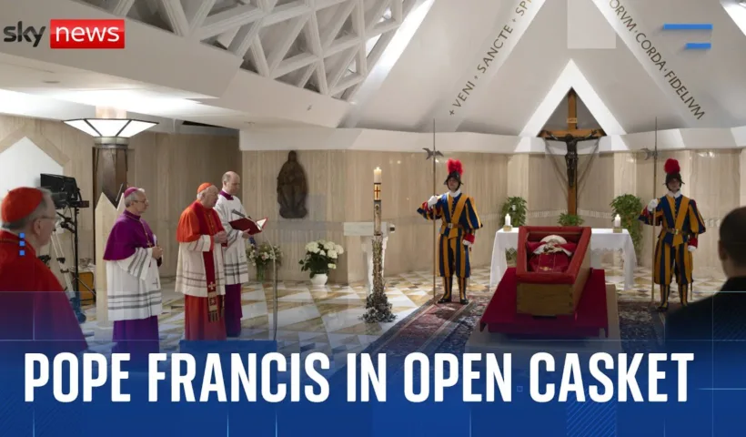 Vatican releases images of Pope in open coffin